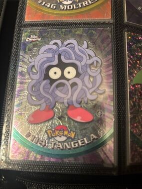 Topps Chrome Pokémon Tangela Trading Card with Purple Tendrils and Red Feet
